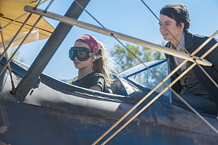 two person on biplane