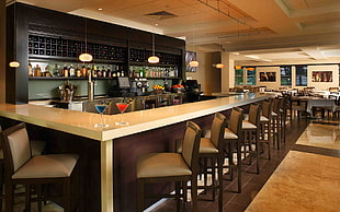 barstools in front of bar counter HD wallpaper