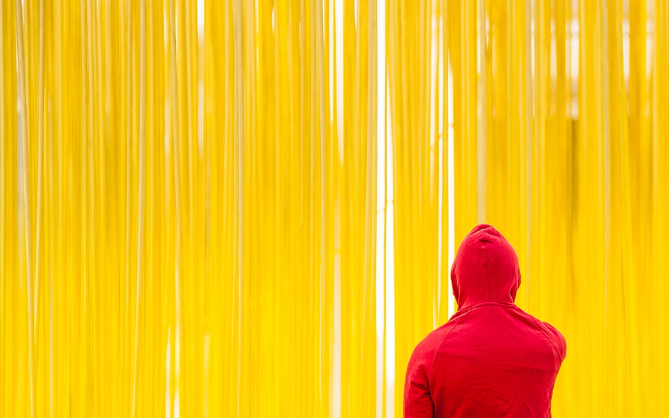 man in red hoodie under the yellow curtain HD wallpaper