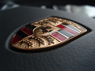 Porsche emblem macro photography HD wallpaper