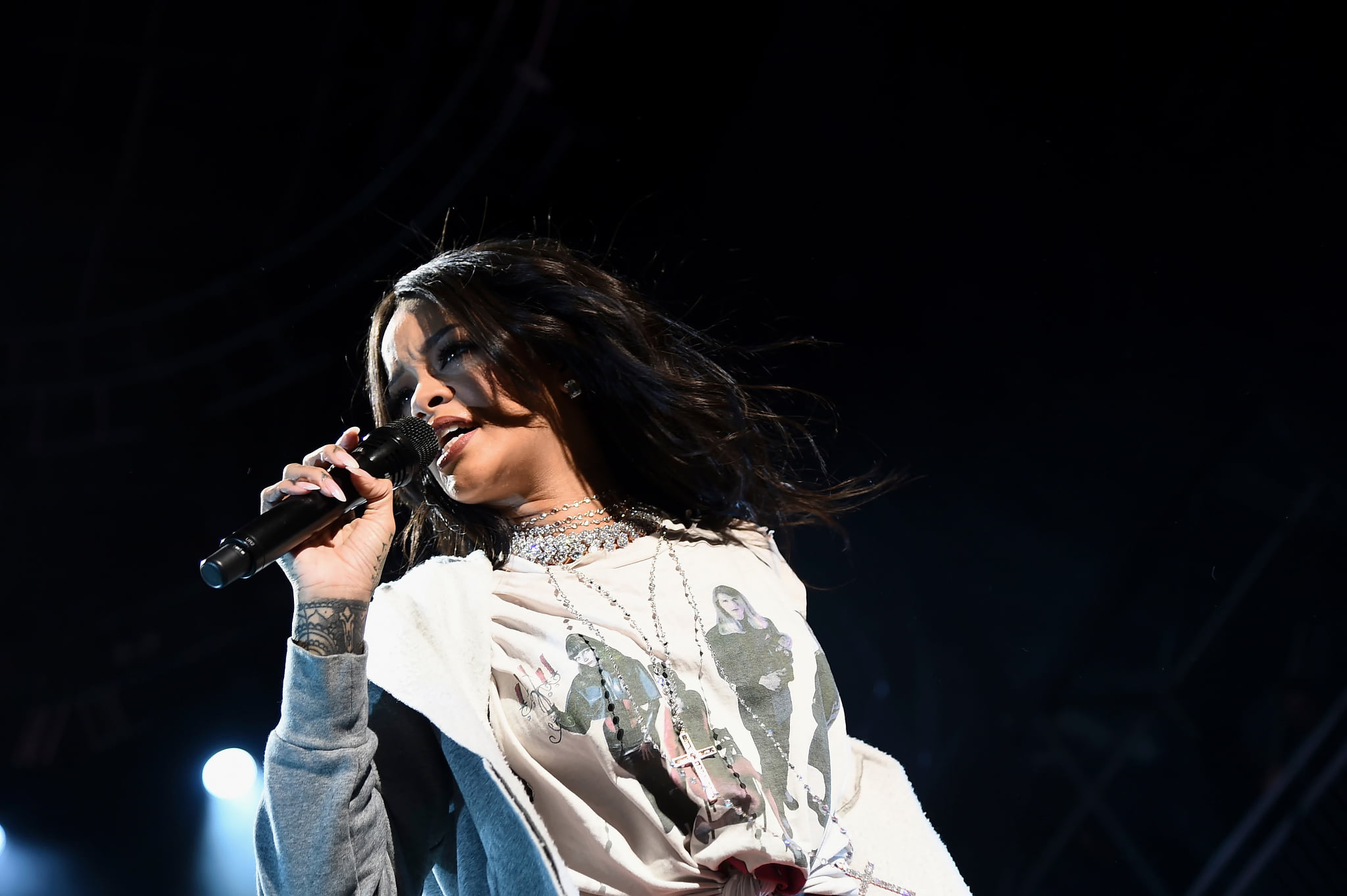 woman holding wireless microphone