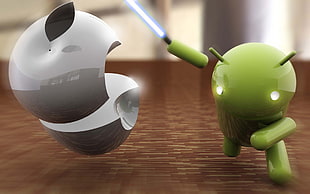 green Android figure holding lightsaber on brown surface HD wallpaper