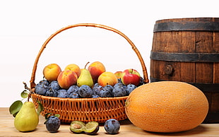 assorted fruits in brown wicker basket