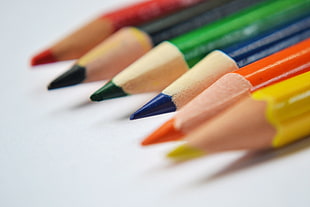 assorted colored pencil on white top
