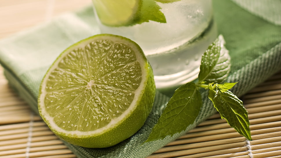 sliced lime beside mint leaf HD wallpaper
