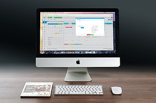 silver iMac with Apple magic keyboard and Apple magic mouse