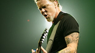 man in black crew-neck t-shirt playing guitar HD wallpaper
