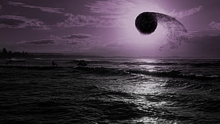 body of water under black moon