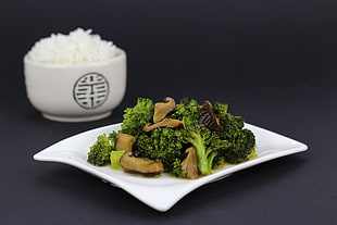 vegetables on plate and rice on bowl