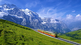 landscape photograph of train and mountains