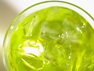 clear drinking glass filled with green liquid substance and ice