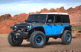 black, white, and blue Jeep SUV
