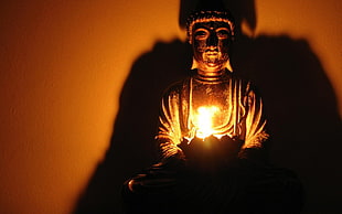 brown metal Buddha figurine with light fixture HD wallpaper