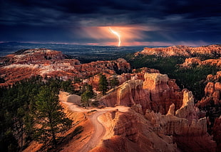 aerial photography of rock formation near trees, nature, landscape, lightning, storm