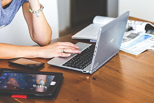 gray Acer laptop on table