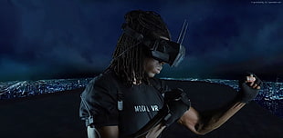 dread haired man wearing black VR headset
