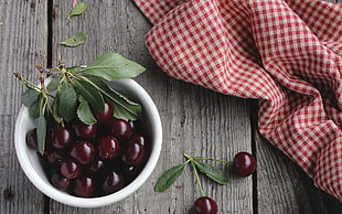 cherry in round white ceramic bowl with gingham pattern textile HD wallpaper