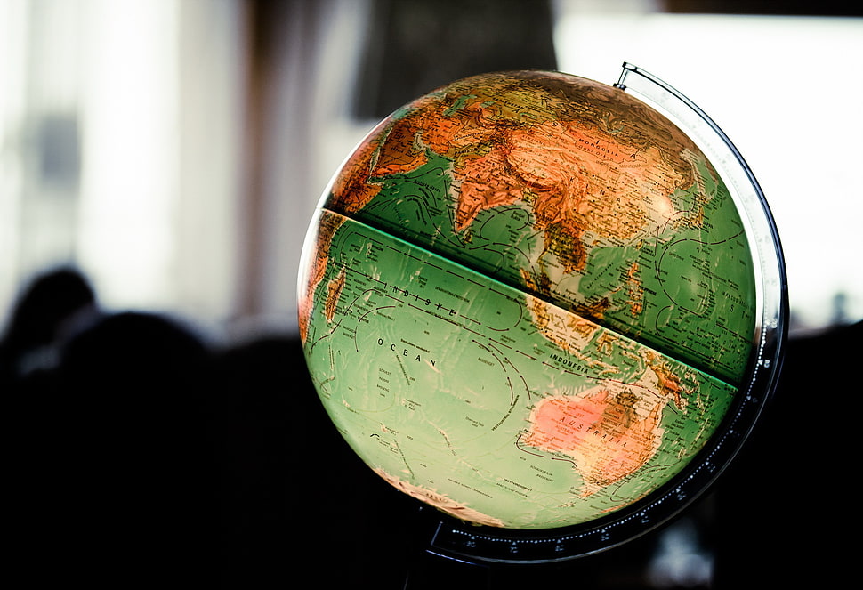 soft focus photography desk globe HD wallpaper