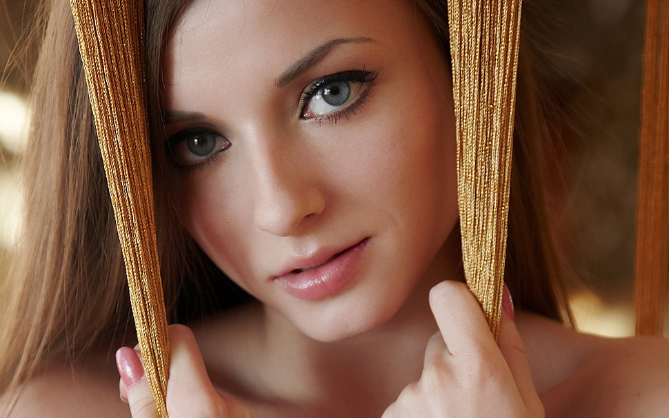 photo of woman holding brown thread decor HD wallpaper