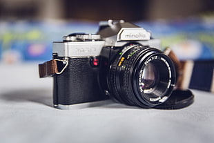 close up photography of black and gray Minolta DSLR camera