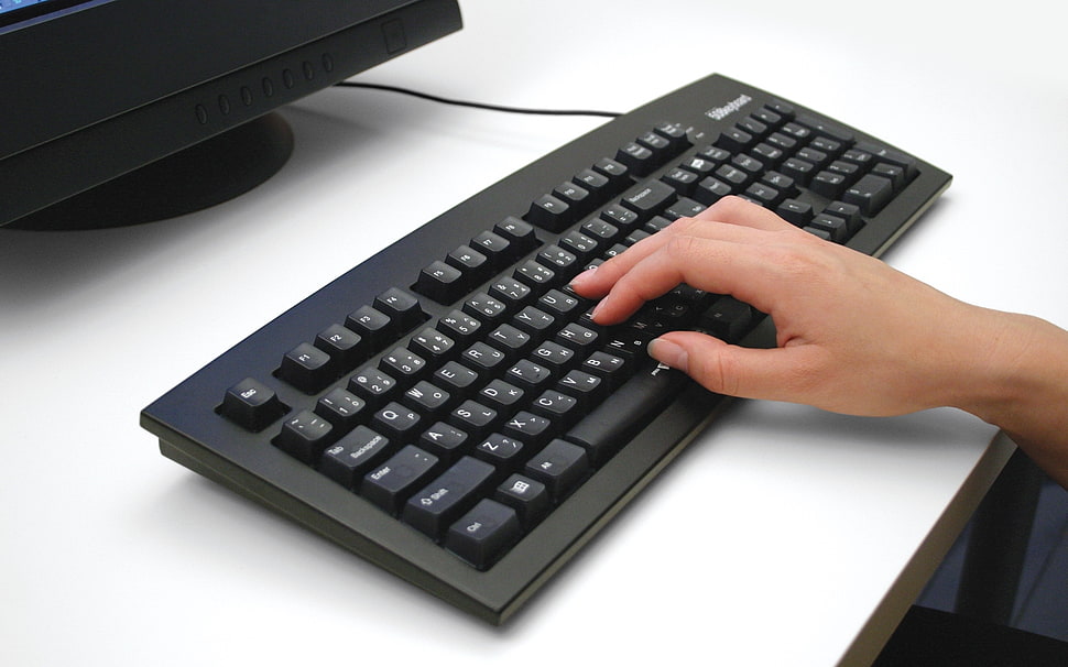 person typing on computer keyboard HD wallpaper