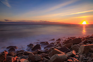 photography of rocks near body of water during sunset, scituate