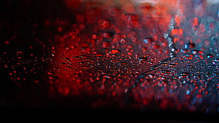 red and black abstract painting, rain, water drops, bokeh, depth of field