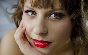 woman wearing red lisptick