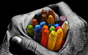 selective colors of person holding multicolored crayons HD wallpaper