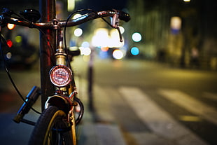 white bicycle on black bar on street, paris