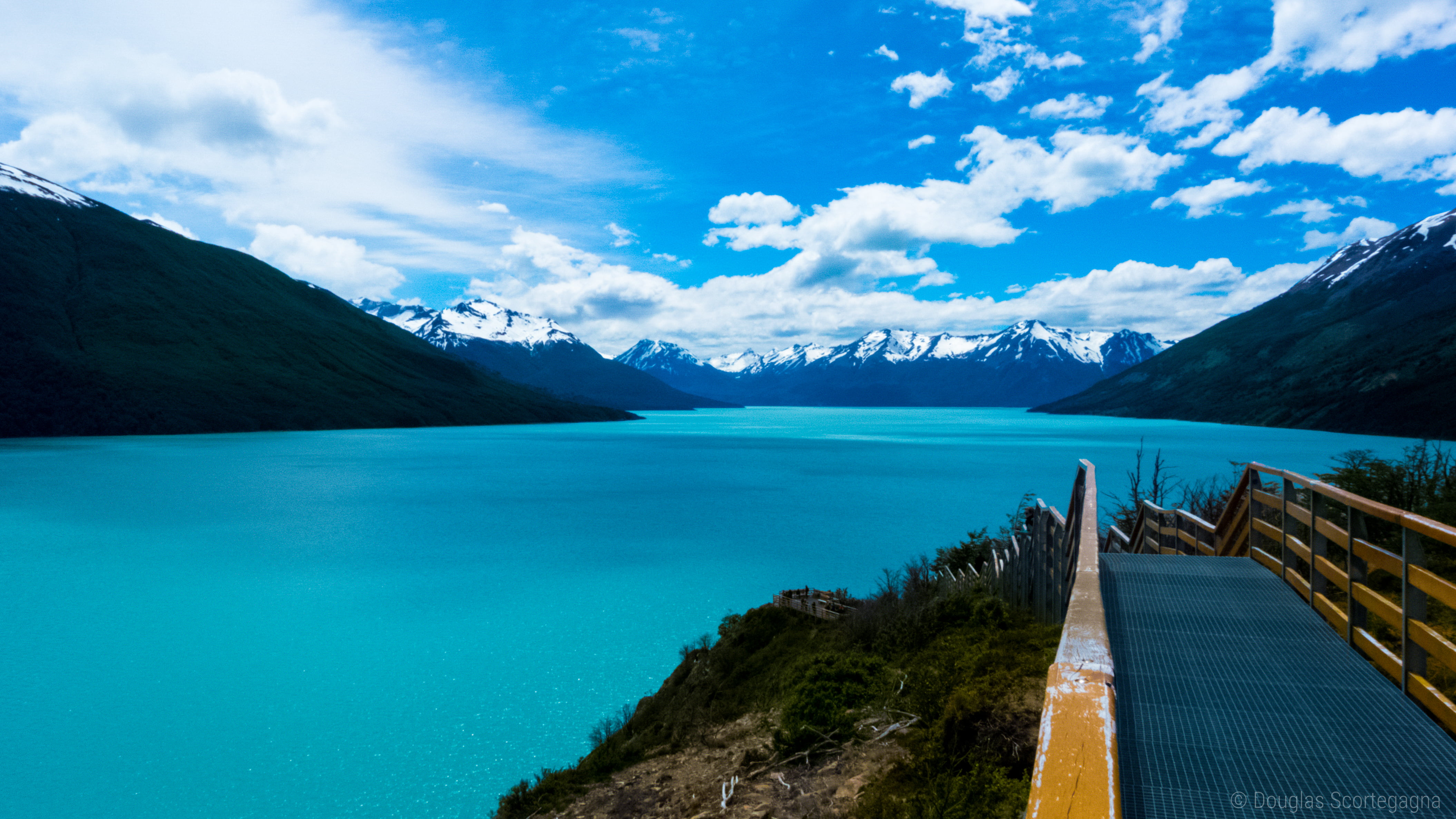 gray and brown steel boardwalk near lake, lago argentino