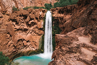 waterfalls between rock formation