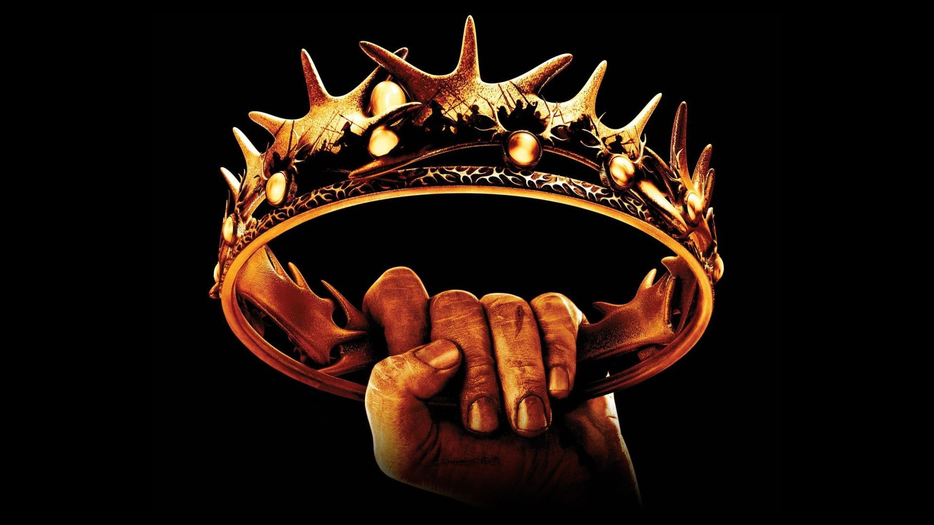 person holding spiky crown