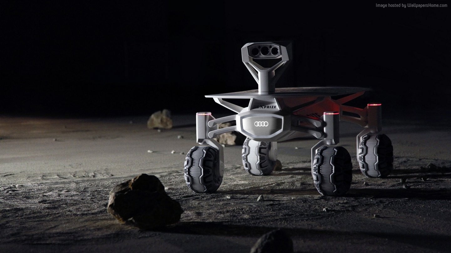 white 4-wheeled controlled device on ground
