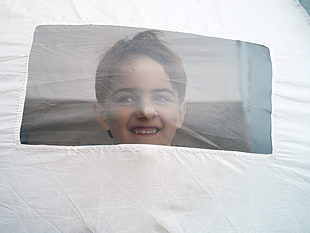 boy on white tent