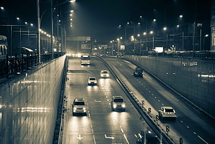 assorted car driving towards underpass during nighttime