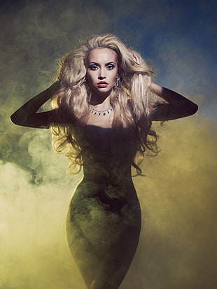 photo of woman with blonde hair and smoke background painting