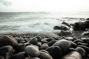 time-lapse photography of stones on seashore