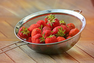 shallow focus photo of red strawberries on strainer