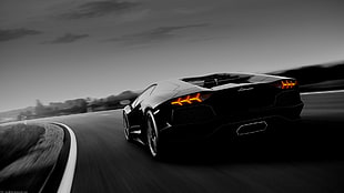 grayscale photo of supercar on road