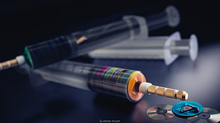 three assorted-color syringes, 3D, compact disc, syringe