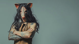 person wearing pig head mask