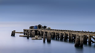 dock near blue ocean water during daytime HD wallpaper