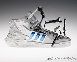 unpaired white and blue mechanical Adidas shoe