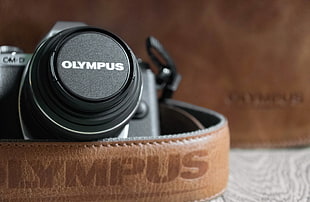 black Olympus DSLR camera in focus photography