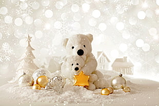 two teddy bears and assorted christmas baubles