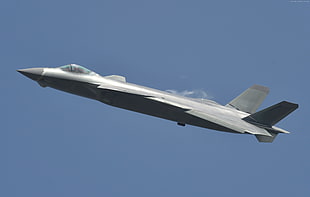 gray fighter jet on flight under calm sky HD wallpaper