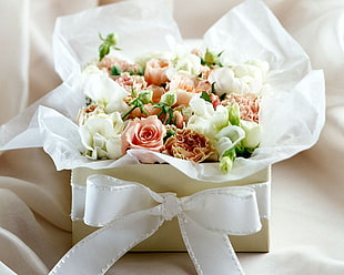bouquet of pink and white flowers in white box