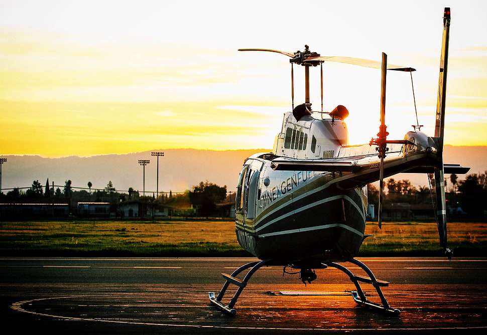 green and white helicopter during sunset HD wallpaper