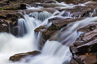 water falls photo near rocks